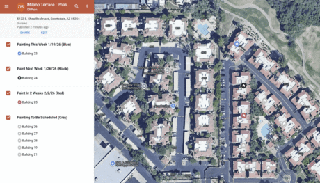 Aerial view of condominium complex with pools